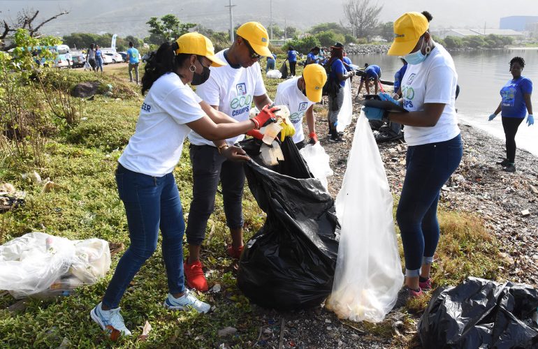Members of staff of The Jamaica National Group at the beach clean-up at Sirgany Beach in east Kington last year.