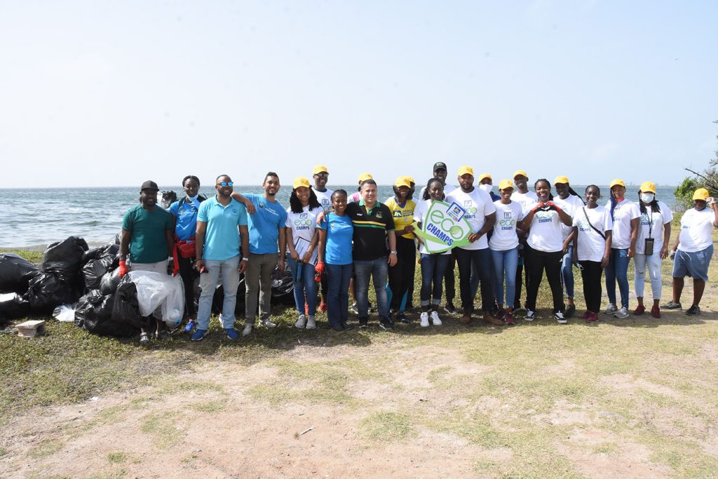 JN members of staff take a group photo after cleaning up the Sirgany Beach.
