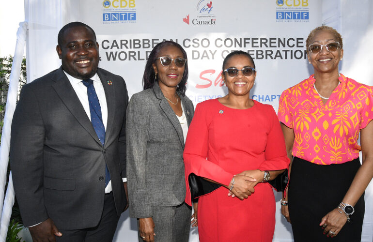 Rose Miller (second right), financial education consultant with the JN Foundation takes a group photo with (from left), Richardo Aiken, operations officer/community development at the Caribbean Development Bank; Claudine Allen, general manager of the JN Foundation and Stephannie Coy, Programme Manager for Field Support Services Project Caribbean, which is funded by the Global Affairs Canada, Local Engagement Action Fund.