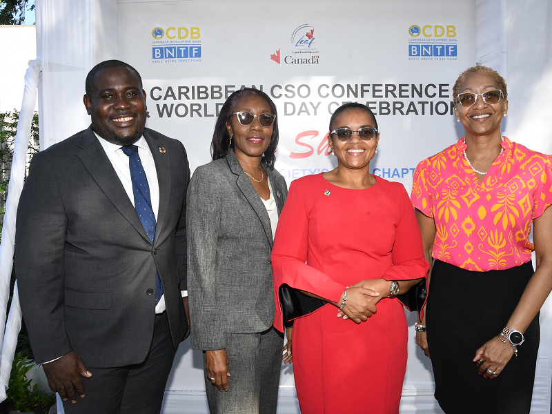 Rose Miller (second right), financial education consultant with the JN Foundation takes a group photo with (from left), Richardo Aiken, operations officer/community development at the Caribbean Development Bank; Claudine Allen, general manager of the JN Foundation and Stephannie Coy, Programme Manager for Field Support Services Project Caribbean, which is funded by the Global Affairs Canada, Local Engagement Action Fund.
