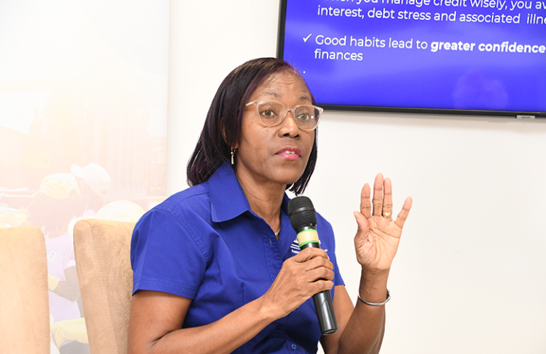 Rose Miller, financial education consultant with the JN Foundation, leads a presentation during a Smarter Credit Workshop hosted by the JN Financial Academy.