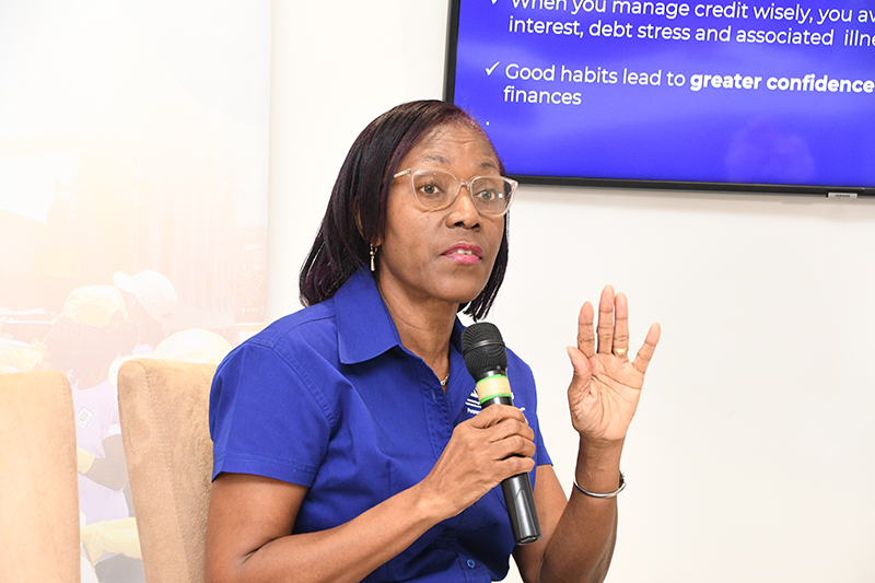 Rose Miller, financial education consultant with the JN Foundation, leads a presentation during a Smarter Credit Workshop hosted by the JN Financial Academy.
